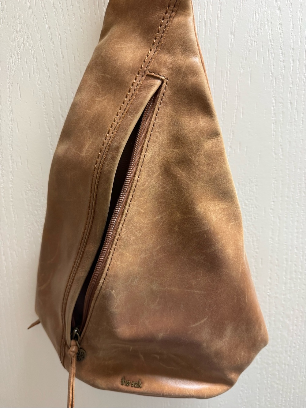 The Sak “Distressed” Leather Sling Bag in Light Brown